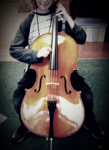 A new student playing cello for the first time!